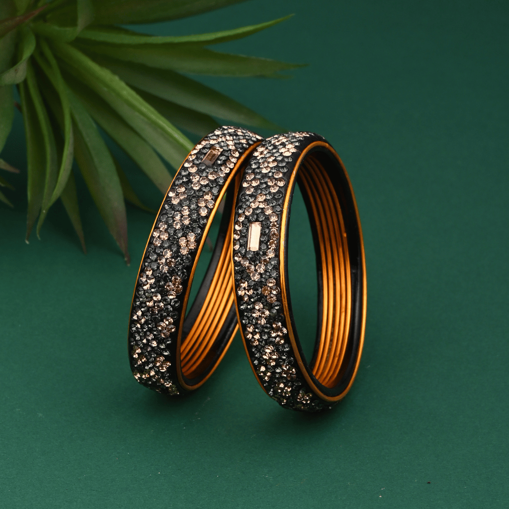 Pair of broad lac bangles in golden and black tones - Lac