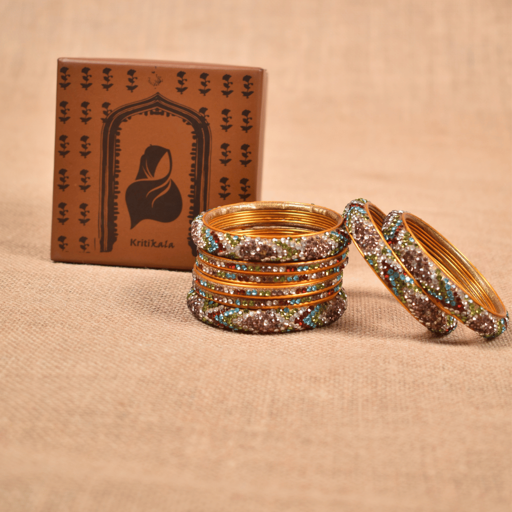 Set of eight bangles in gold & white tones