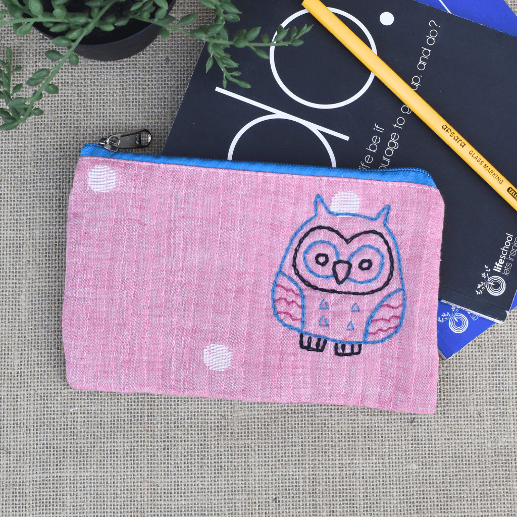 Light pink hand embroidered pouch - front