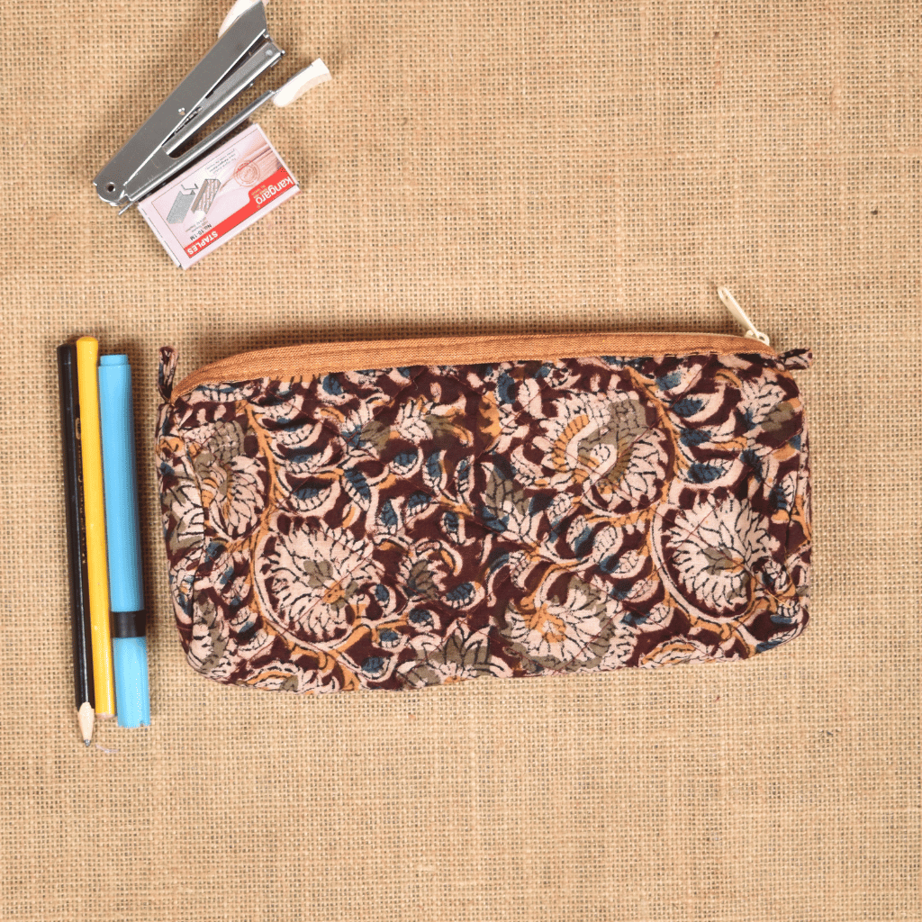 Maroon kalamkari round quilted case - front
