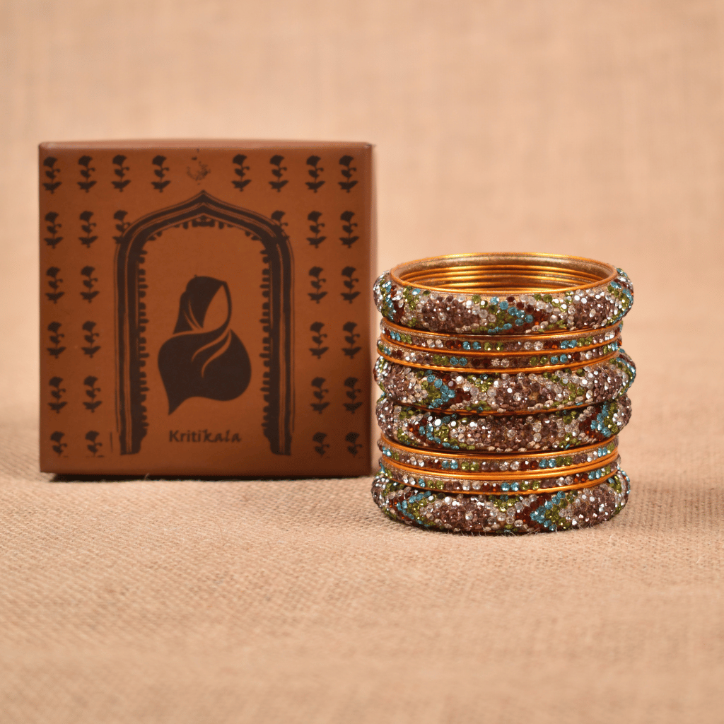 Set of eight bangles in gold & white tones