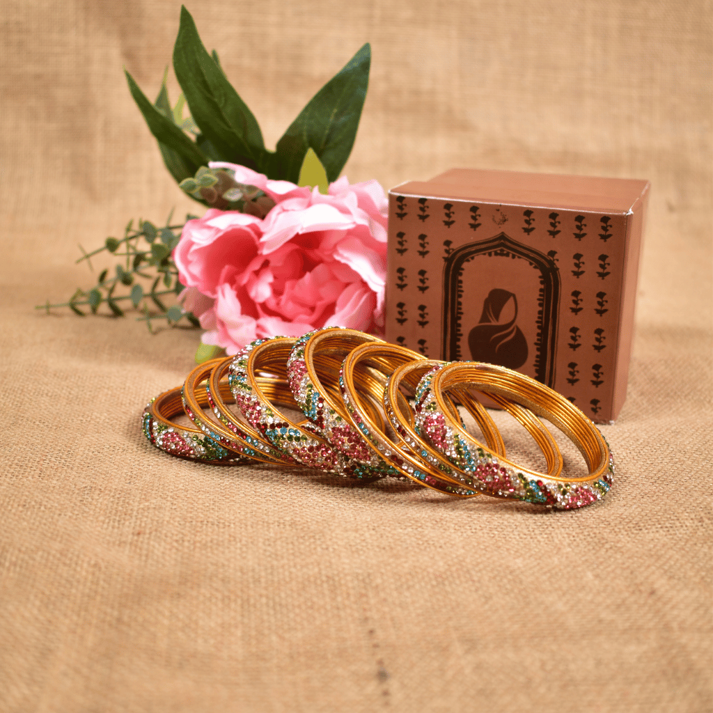 Set of eight bangles in pink & white tones