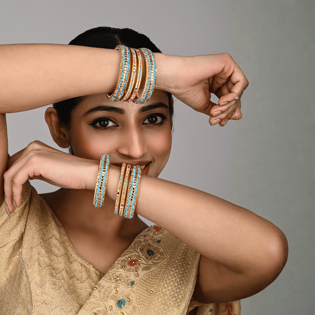 Set of eight bangles in gold & blue tones - lac