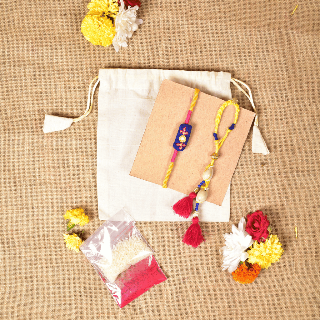 Handcrafted Bhai Bhabhi Rakhi Set with Cotton Potli, Kumkum & Rice - Blue