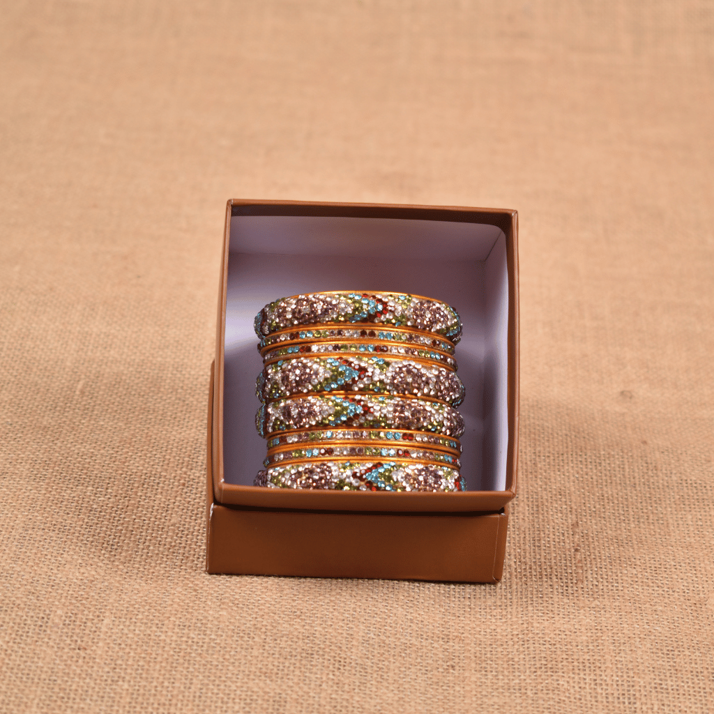 Set of eight bangles in gold & white tones