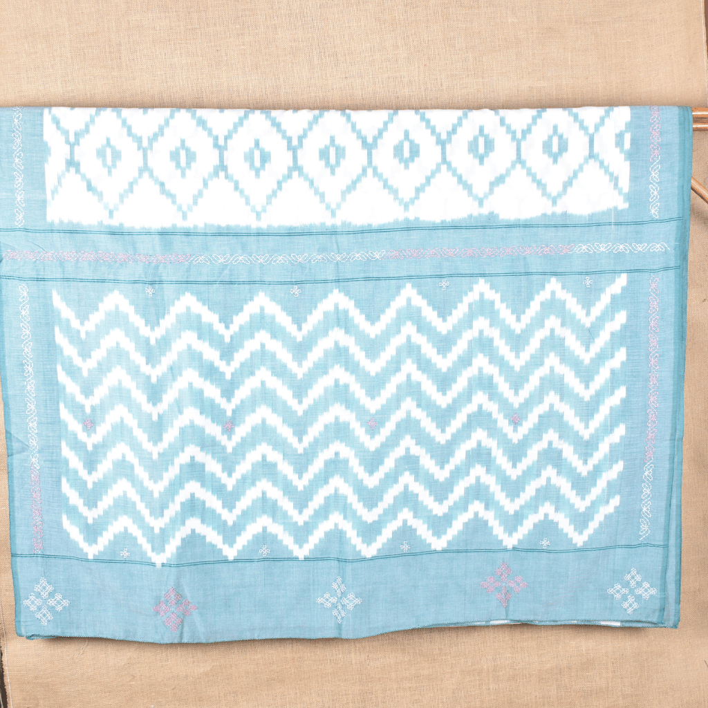 White ikat saree with hand embroidery