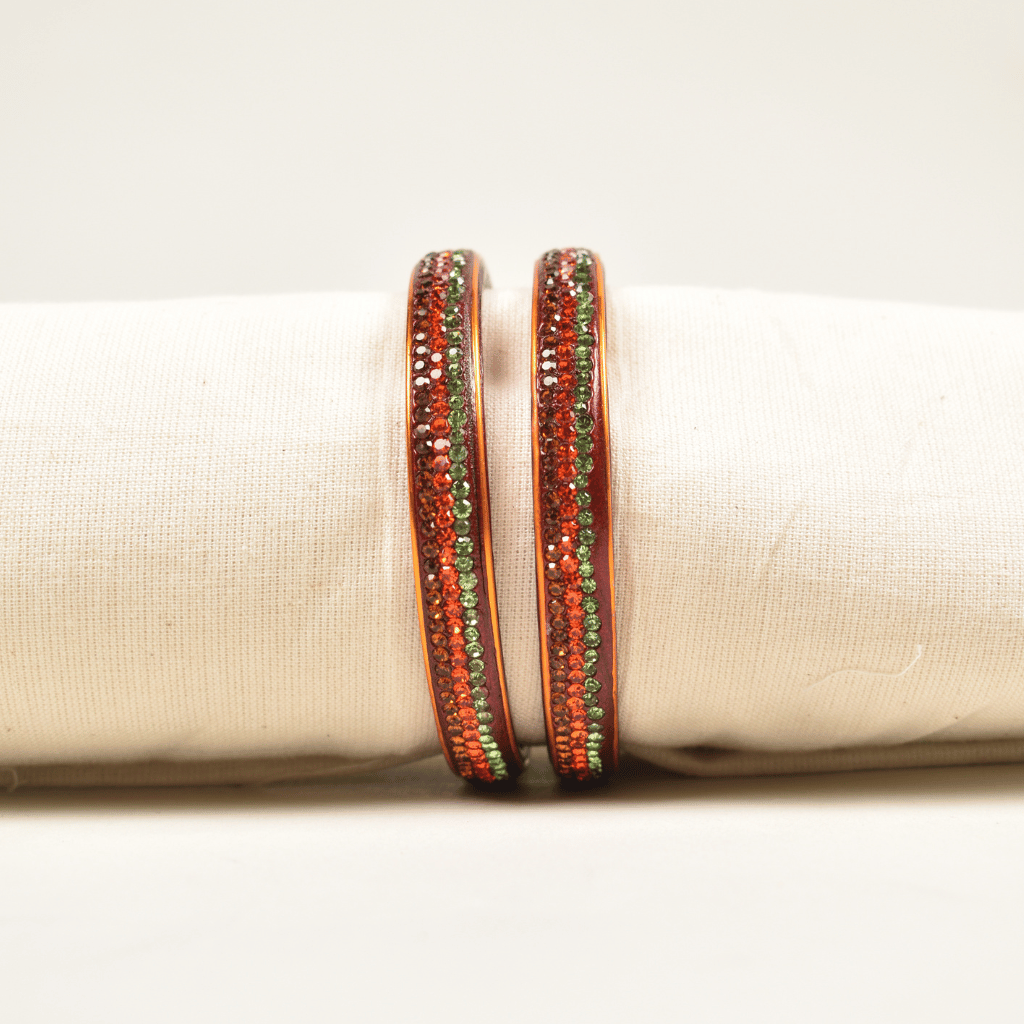 Pair of orange 3 line stoned lac bangles - stones