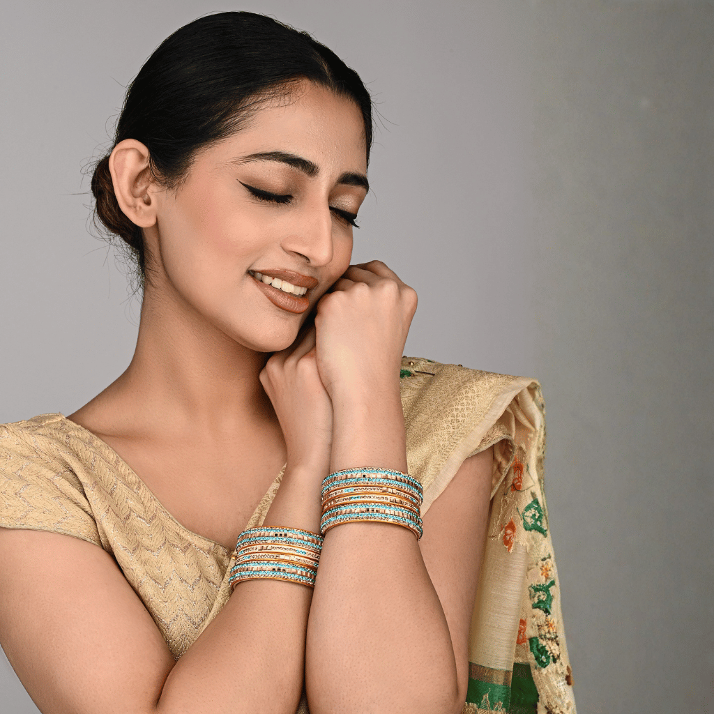 Set of eight bangles in gold & blue tones - Hyderabad