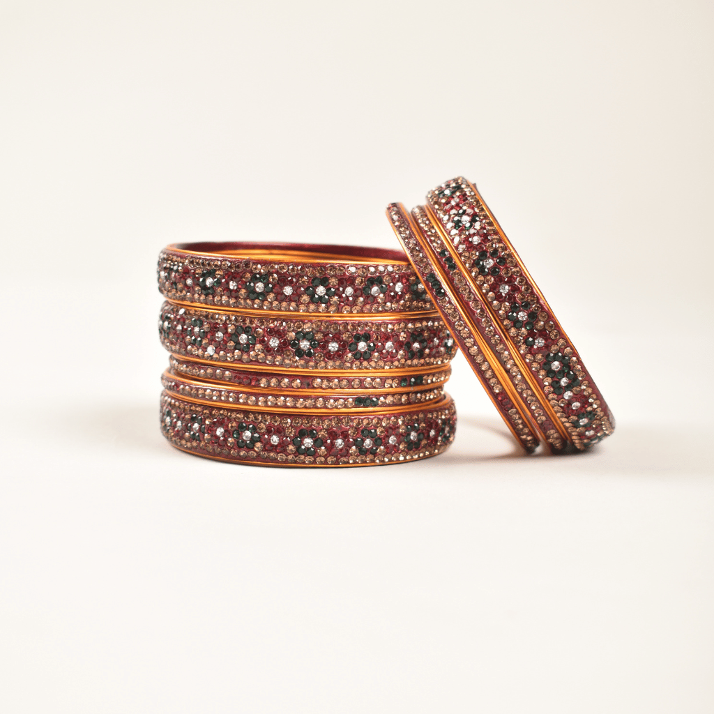 Pair of lac bangles in red & green stones