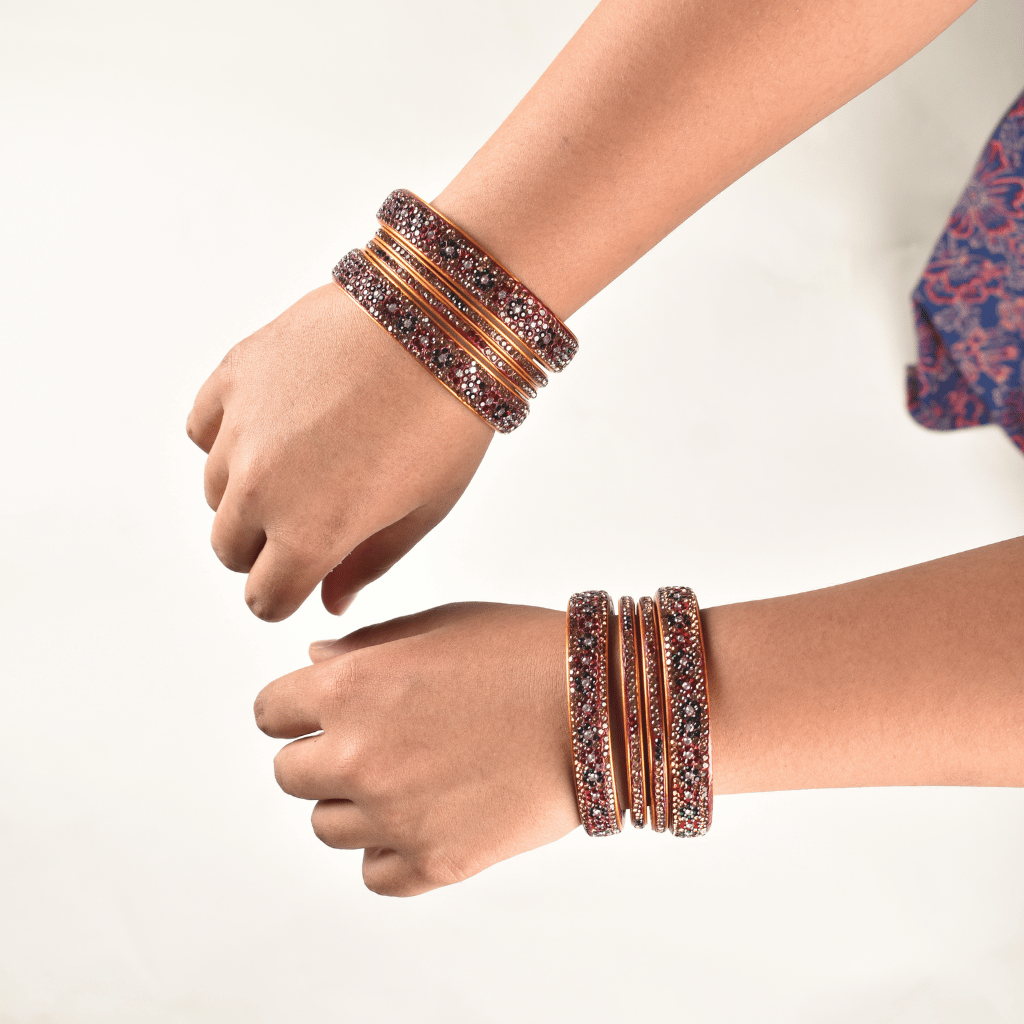 Pair of lac bangles in red & green stones