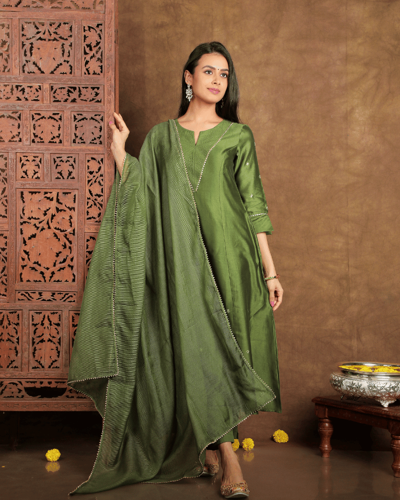 Fida A line Chanderi Silk Kurta and Pant Set with a v shaped yoke  and kalis in Moss Green