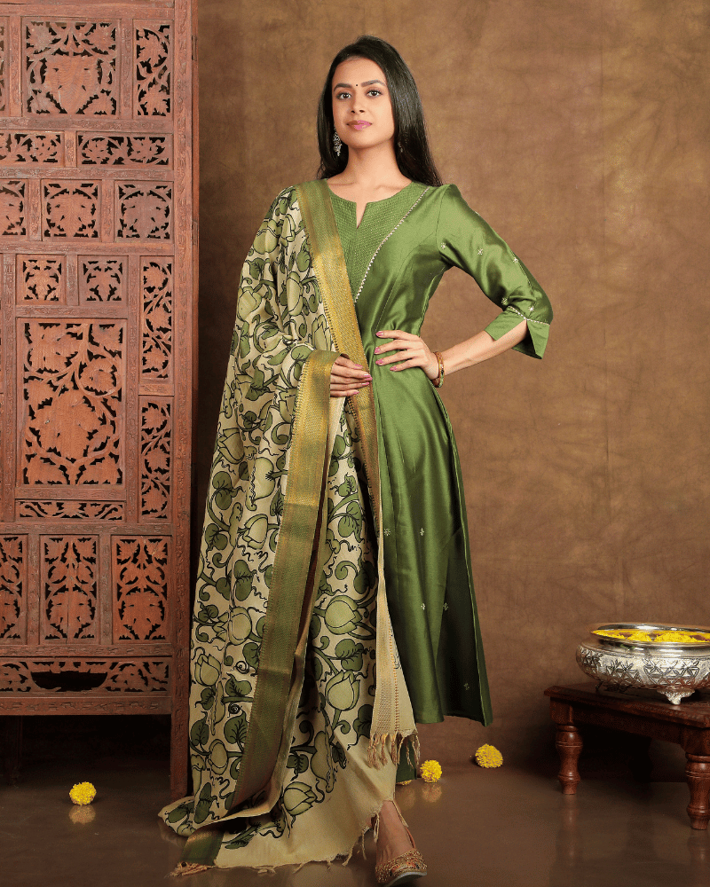 Fida A line Chanderi Silk Kurta and Pant Set with a v shaped yoke  and kalis in Moss Green