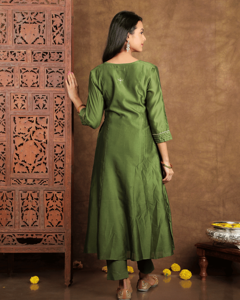 Fida A line Chanderi Silk Kurta and Pant Set with a v shaped yoke and kalis in Moss Green