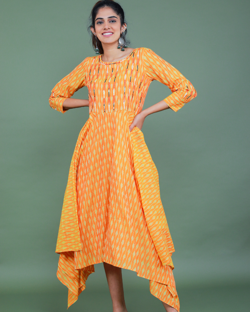 Golden yellow semi silk ikat dress with a handkerchief hem