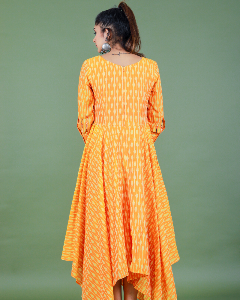 Golden yellow semi silk ikat dress with a handkerchief hem