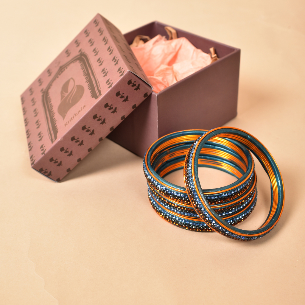 Pair of bangles with blue and golden stones