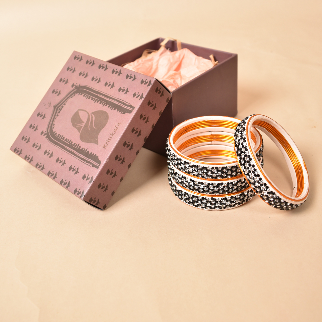 Pair of broad bangles in black and white tones