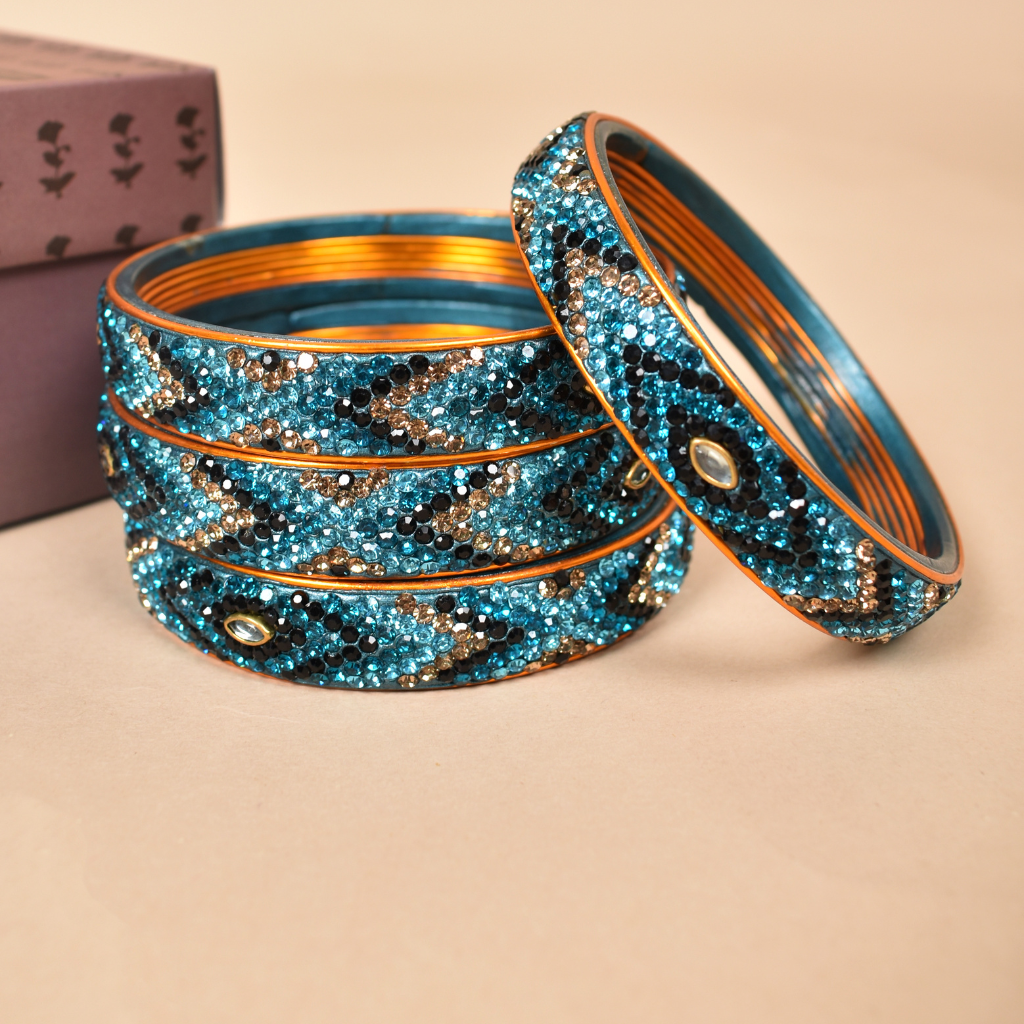 Pair of broad bangles in blue and black tones