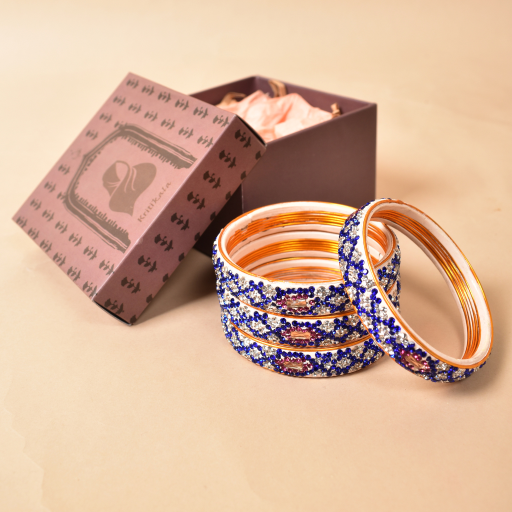 Pair of broad bangles in white and blue tones