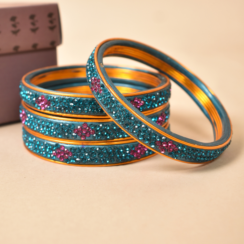 Pair of lac bangles in blue and pink stones