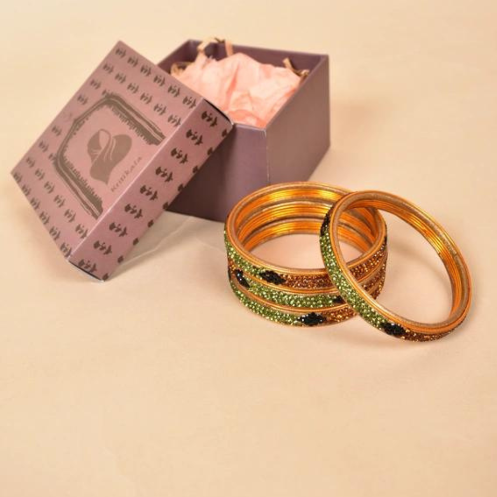 Pair of stone studded lac bangles in golden green tones