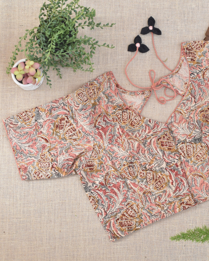 Pink kalamkari blouse with flower tassels - front