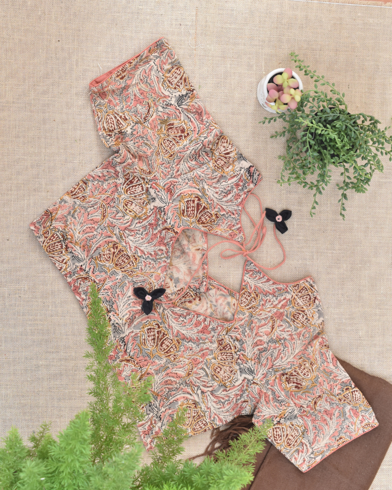 Pink kalamkari blouse with flower tassels - back