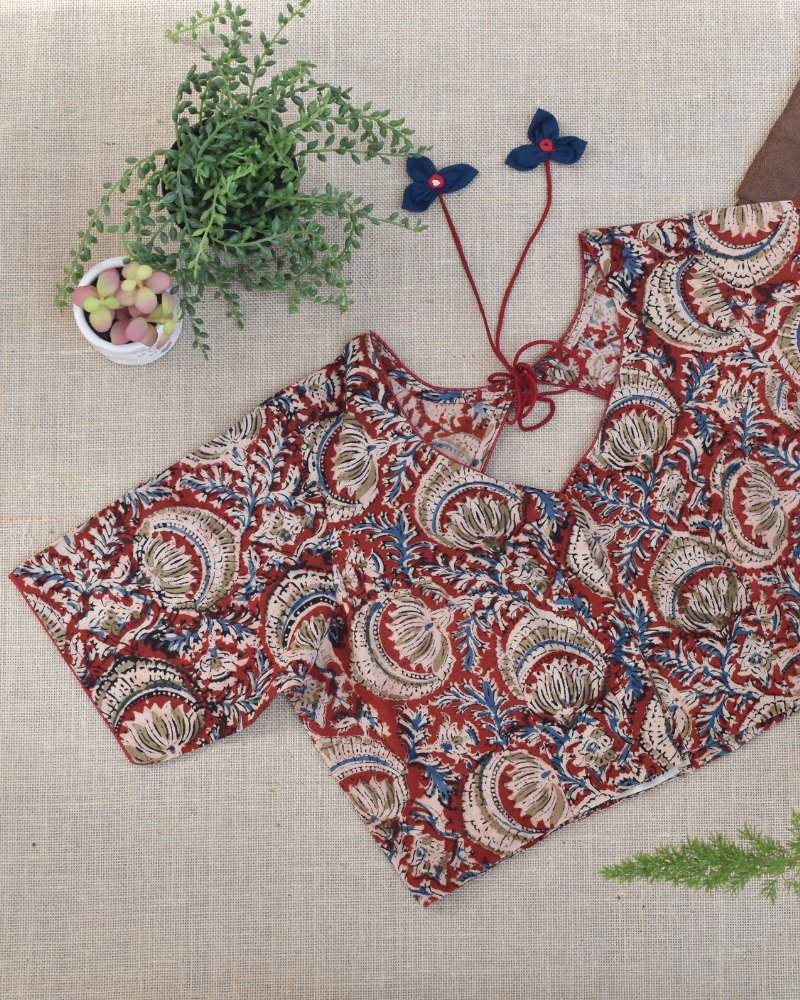 Red kalamkari blouse with flower tassels