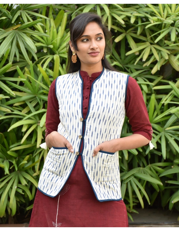 Reversible sleeveless quilted jacket in blue and white ikat