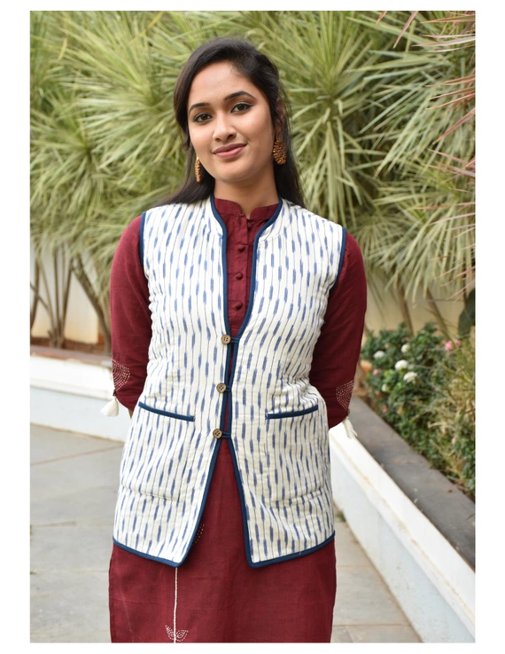 Reversible quilted jacket in blue and white ikat - sleeveless