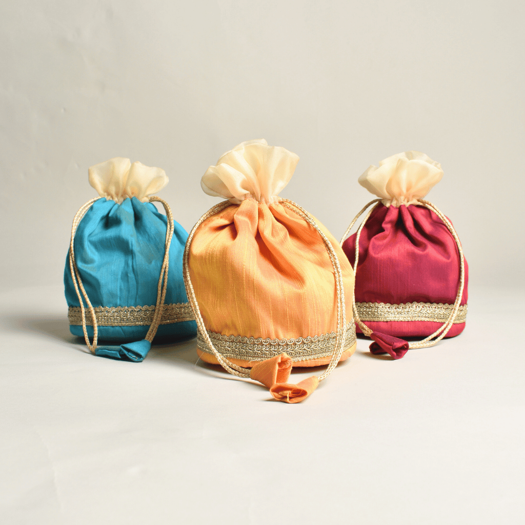 Round base silk potli with tissue frill and lace