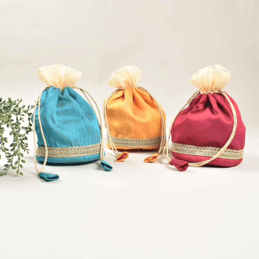 Round base silk potli with tissue frill and lace