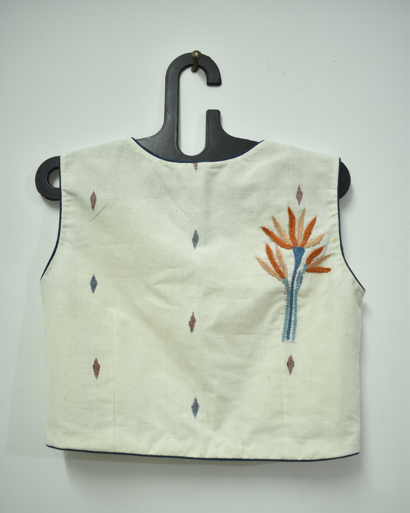 Off-white saree blouse with orange flower motif - back