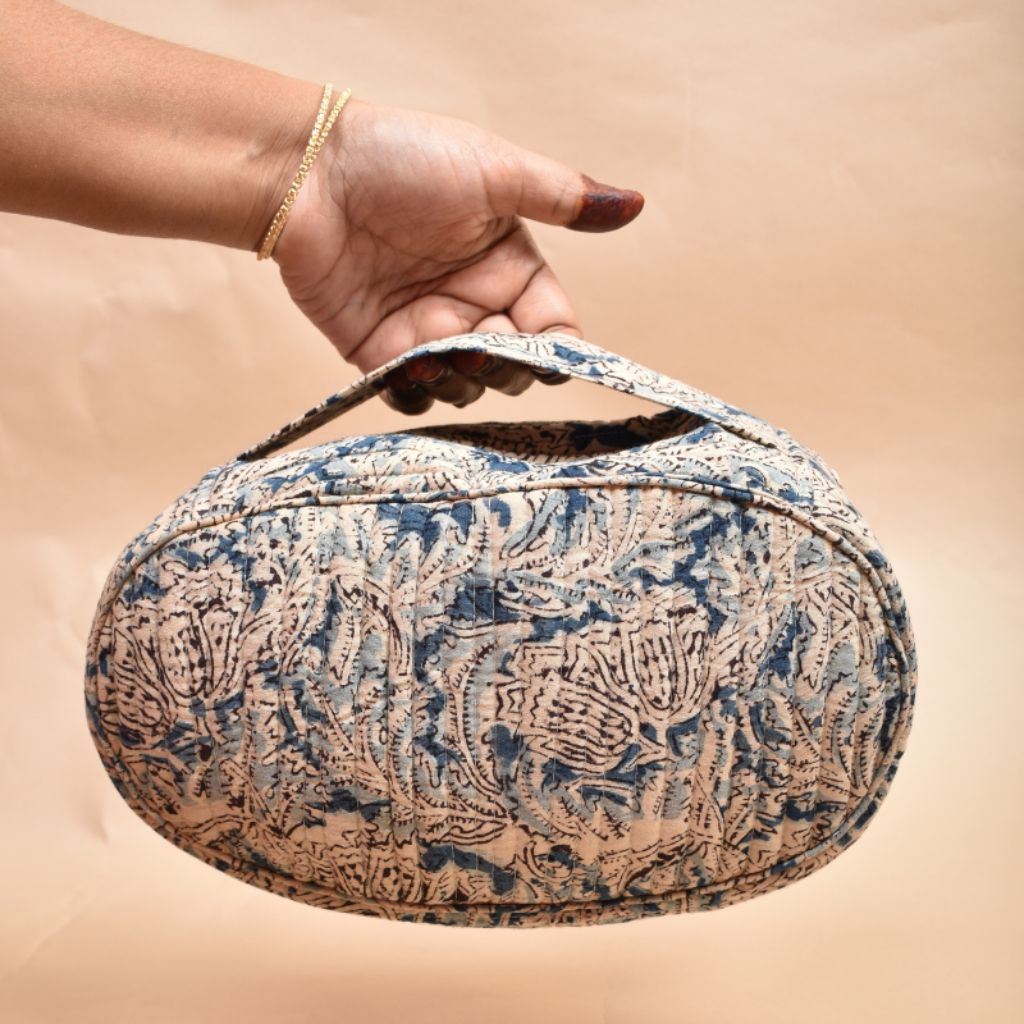Fabric vanity kit or blue quilted toiletry case in kalamkari cotton - handle