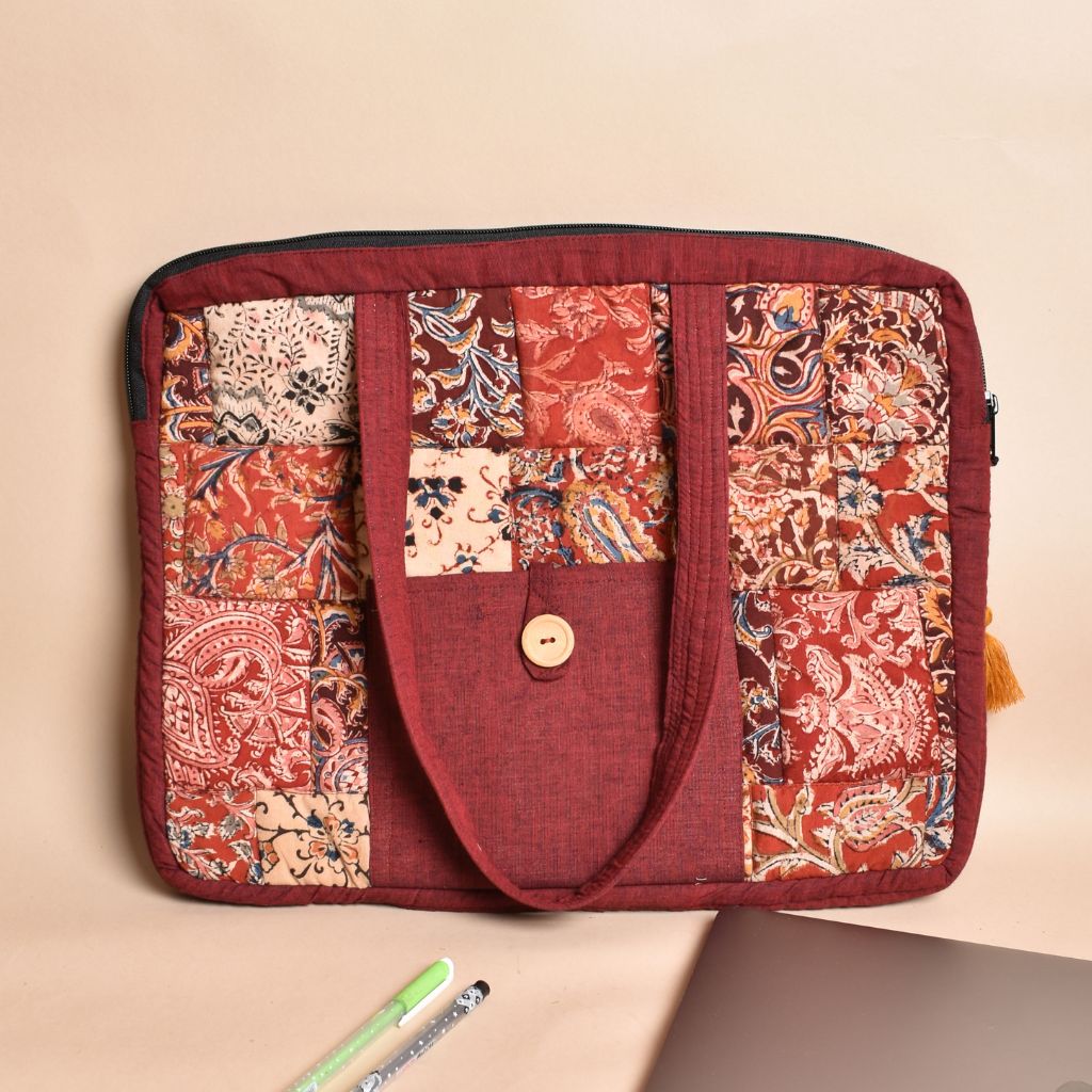 Maroon cotton laptop bag with short handles and quilted design