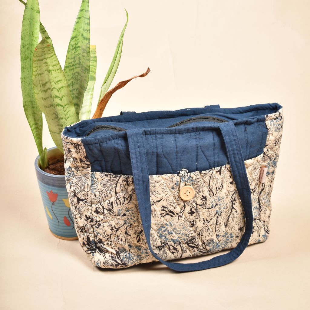 Quilted handbag in blue and white ikat with multiple pockets