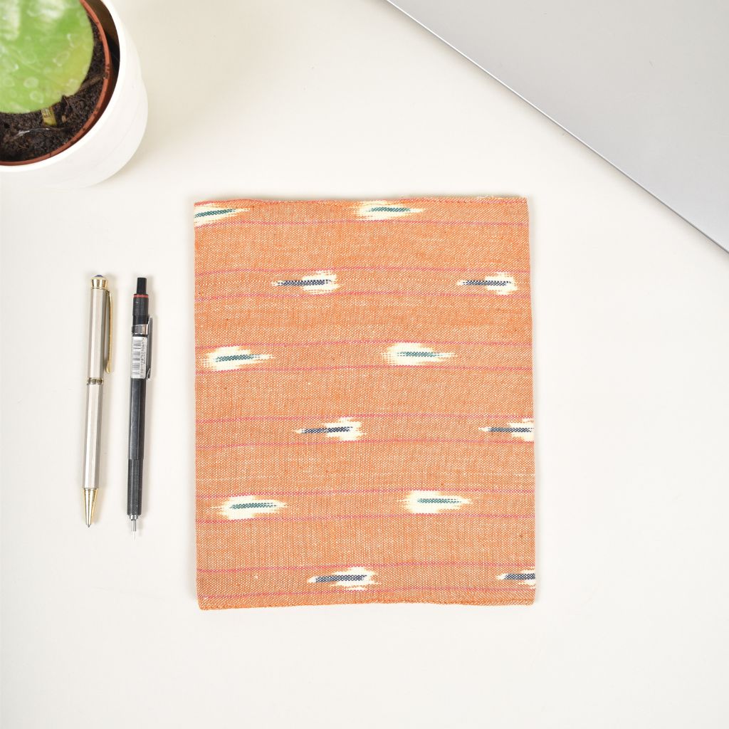 Orange journal sleeve with white cotton lining and  a handmade paper diary - back