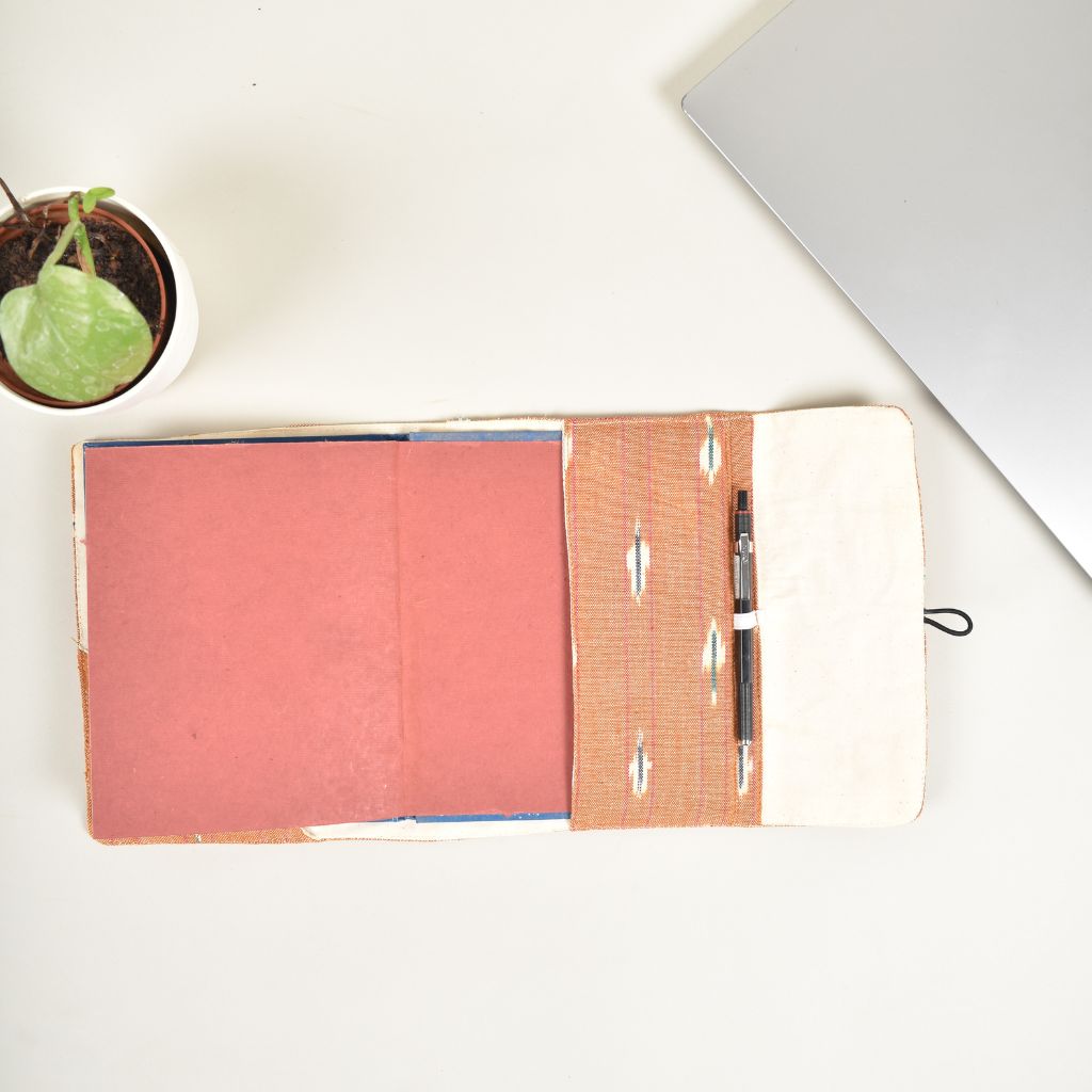 Orange journal sleeve with white cotton lining and  a handmade paper diary - inside