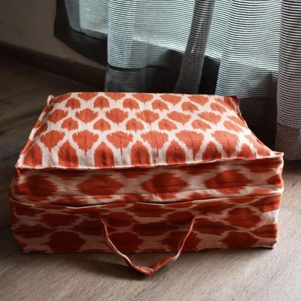 Saree storage bag in orange ikat cotton with set of ten saree sleeves
