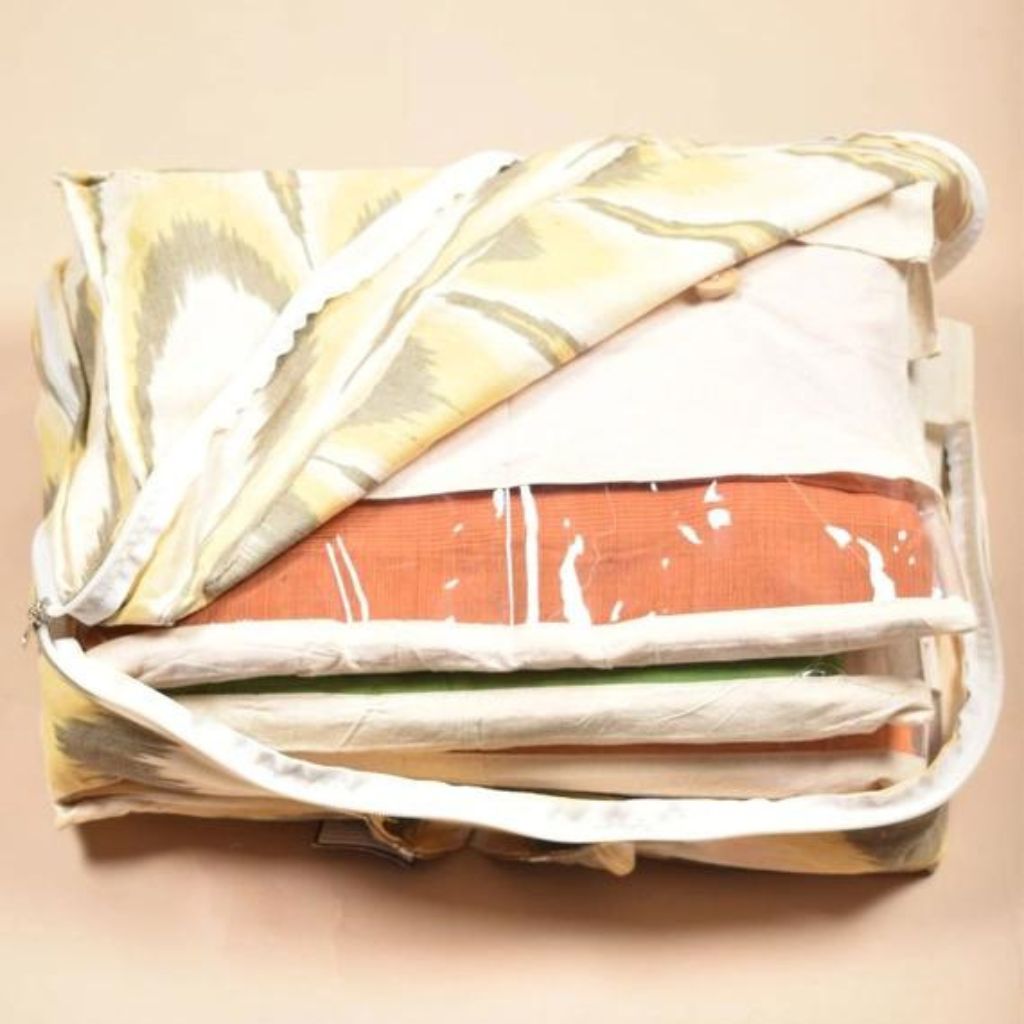 Yellow ikat garment organiser with set of 10 saree sleeves