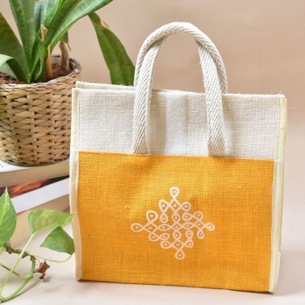 Yellow and white jute lunch bag with traditional motif - front