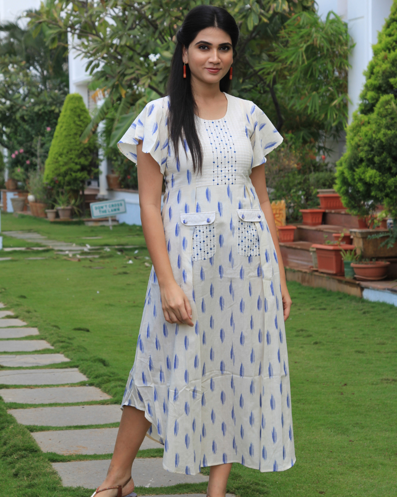 WHITE IKAT PLEATED DRESS WITH EMBROIDERED POCKETS AND YOKE