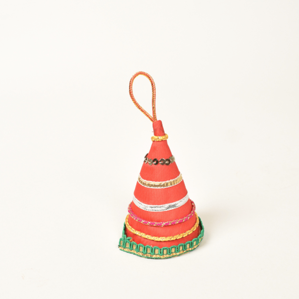 Handmade fabric keychain shaped like Diwali Anar cracker – festive accessory