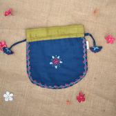 Festive blue potli bag with feather stitch embroidery and handmade tassels