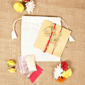 Pearl Bhai Bhabhi Rakhi Set with Golden Floral Beads & Cotton Potli
