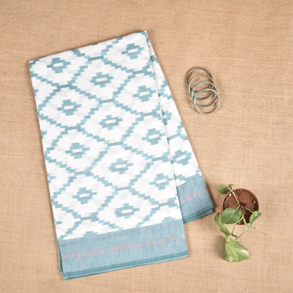 White ikat saree with hand embroidery