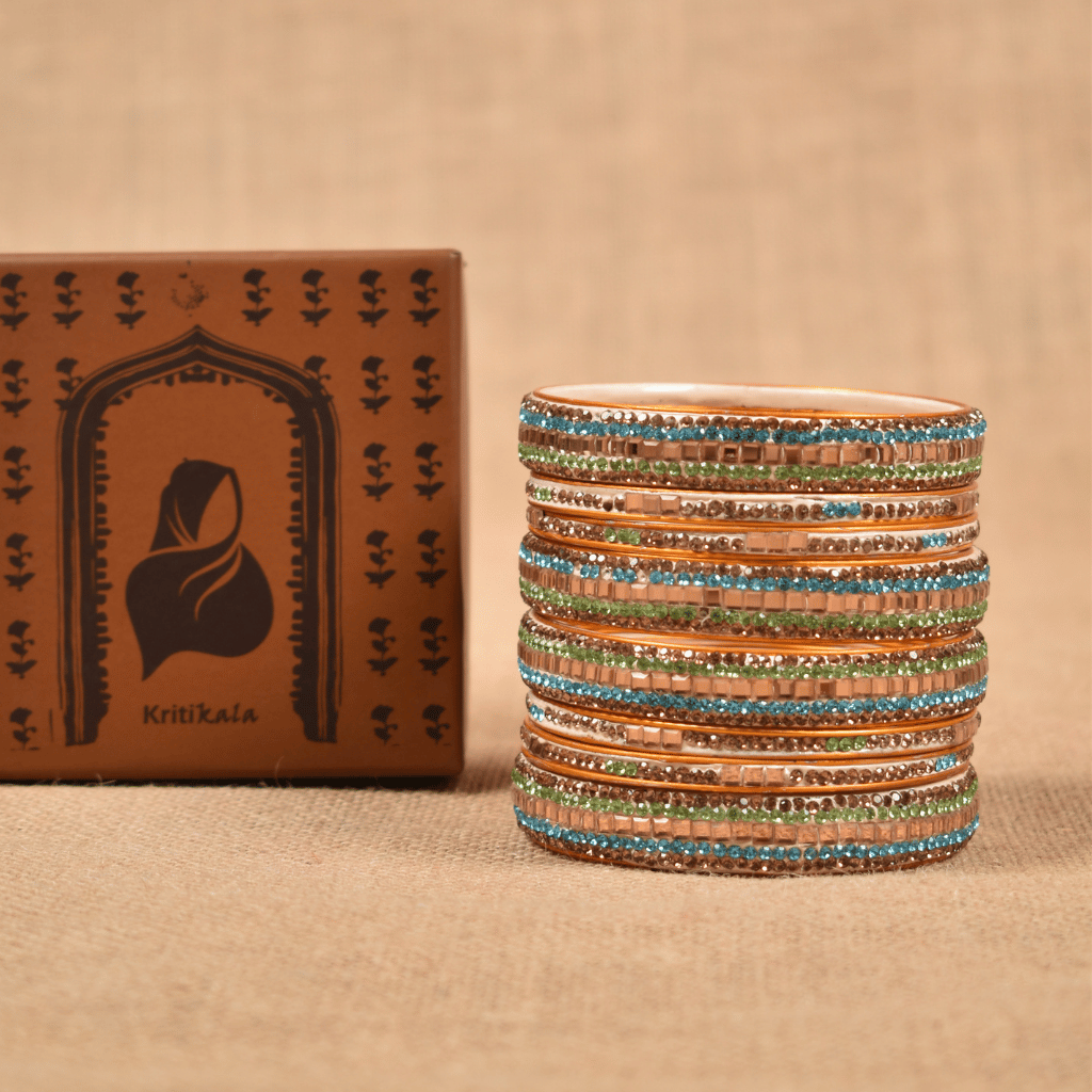 Set of  eight bangles in gold & blue tones