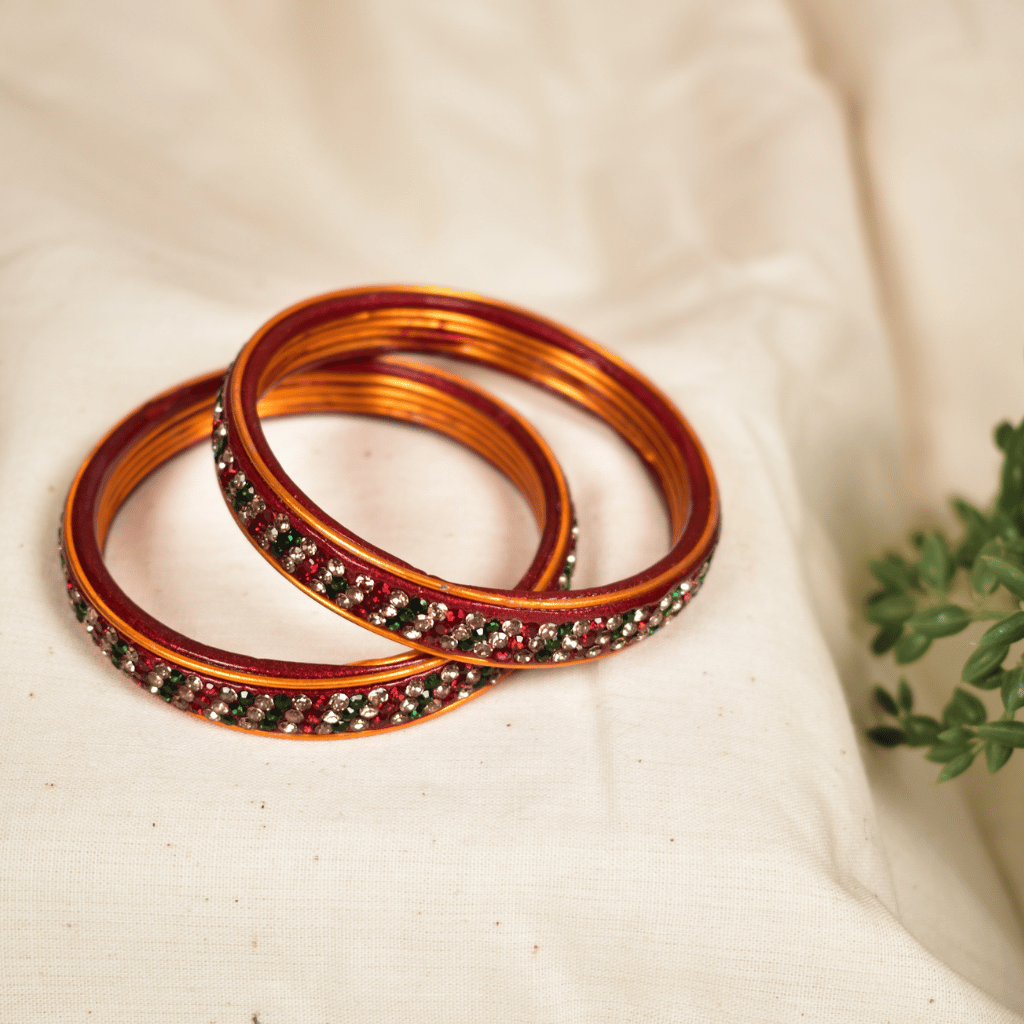 Pair of lac bangles in gold and red tones