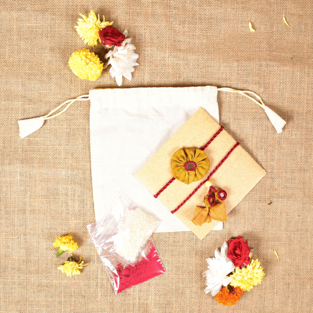 Handcrafted Bhai Bhabhi Flower Rakhi Set with Cotton Potli, Kumkum & Rice - Yellow