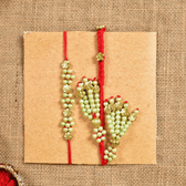 Pearl Bhai Bhabhi Rakhi Set with Golden Floral Beads & Cotton Potli